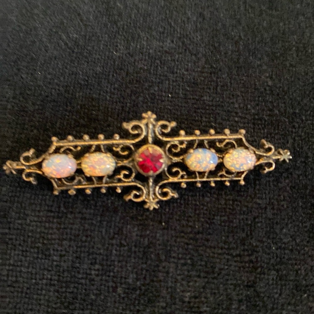 Sarah Coventry Gold Pin with Opal and Ruby stones. New Condition. 2” wide.